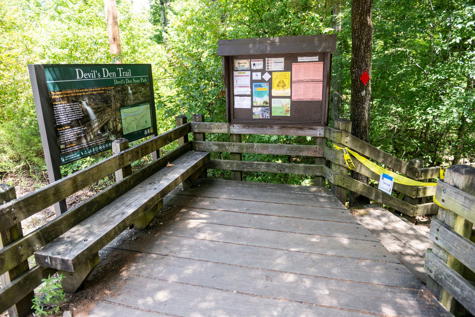 The trail head to the Devil's Den trail at Devils Den State Park remains closed Monday, July 28, 2025, in West Fork, Ark. Police in Arkansas are searching for a suspect in the deaths of a couple who investigators said were attacked while on the wooded walking trail with their two young daughters. (AP Photo/Michael Woods)
