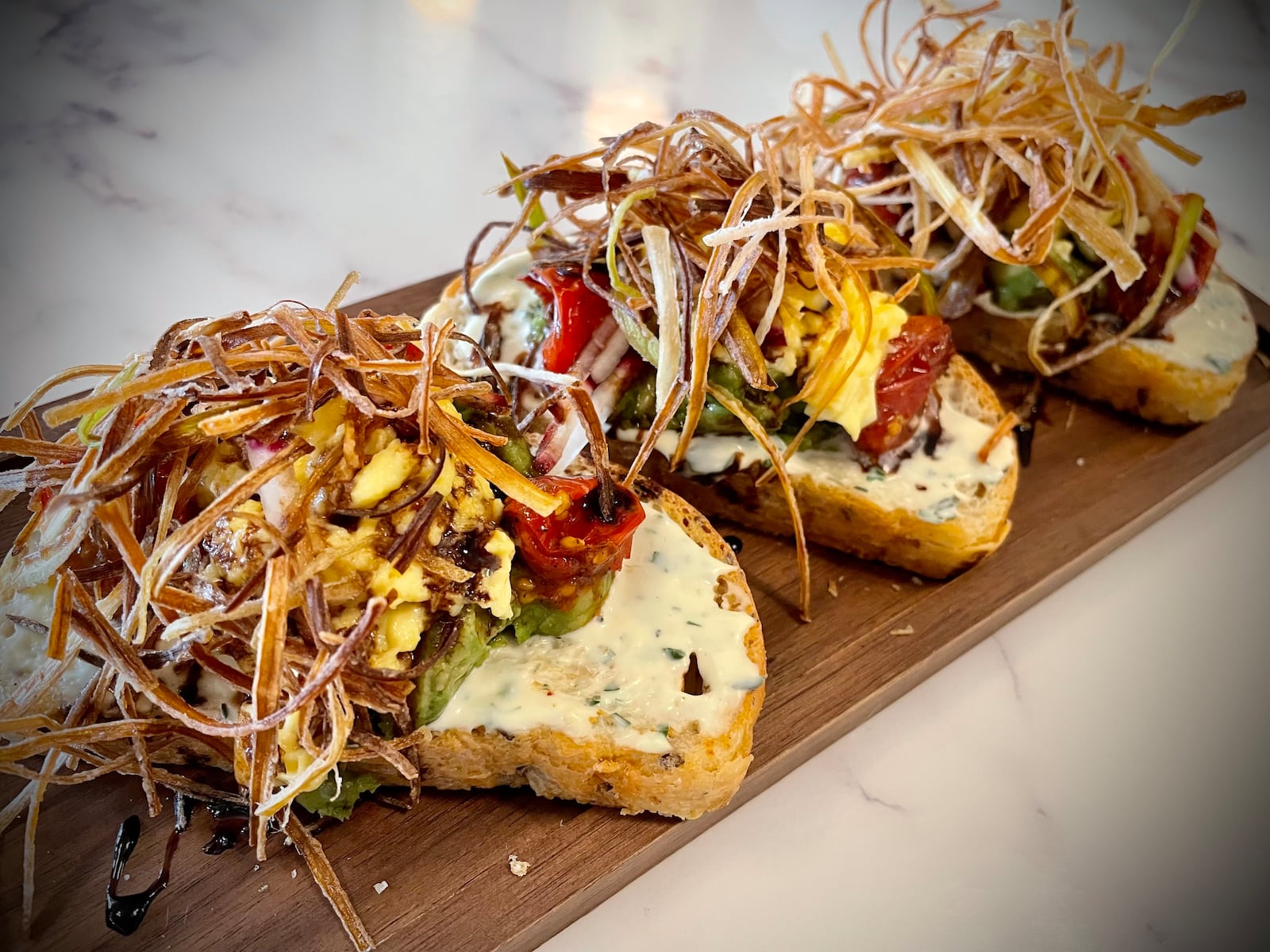 Calzada’s Kitchen, a family with more than a decade of experience working at Carillon Historical Park in Dayton, is now operating Culp’s Café. Pictured is the Avocado Toast. NATALIE JONES/STAFF