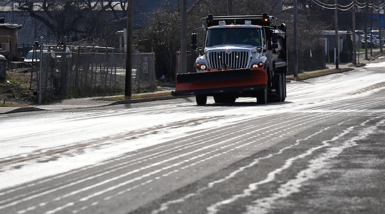 A Nashville Department of Transportation truck applies salt brine to a roadway Thursday, Jan. 22, 2026, in Nashville, Tenn. ahead of a winter storm expected to hit the state over the weekend. (AP Photo/George Walker IV)