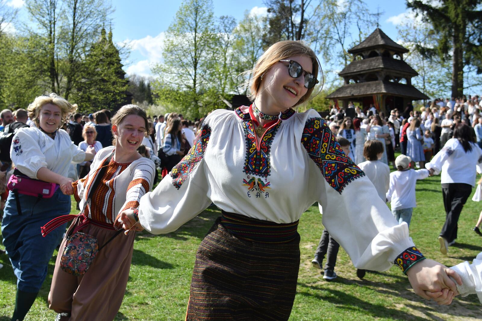 People in traditional Ukrainian clothes perform folk dances during celebrations for Orthodox Easter at the Museum of Folk Architecture and Life in Lviv, Ukraine, on Sunday, April 20, 2025. (AP Photo/Mykola Tys)
