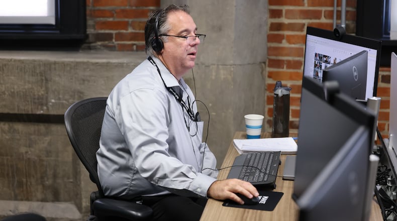 Dayton Daily News reporter Michael Kurtz works a desk in the paper's office in downtown Dayton on Thursday, Sept. 11. BRYANT BILLING / STAFF