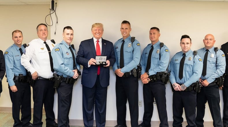 President Donald Trump meets with police officers involved in Sunday’s shooting during his visit to Miami Valley Hospital Wednesday. (left to right) Brian Rolfes, Sgt. Chad Knight, David Denlinger, Vincent Carter, Jeremy Campbell, Ryan Nabel and Jason Berger (Berger didn t fire his weapon). White House photo