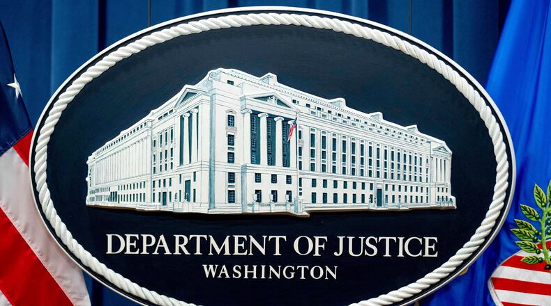 FILE - The Justice Department sign is shown in Washington, Nov. 18, 2022. (AP Photo/Andrew Harnik, File)