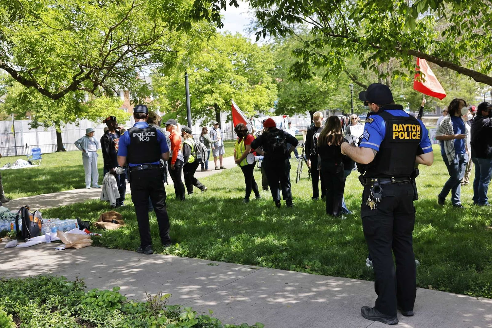 Protesters gathered at Cooper Park behind the Dayton Metro Library Main branch on Saturday, May 24, 2025, down the street from the NATO Parliamentary Assembly. NICK GRAHAM / STAFF