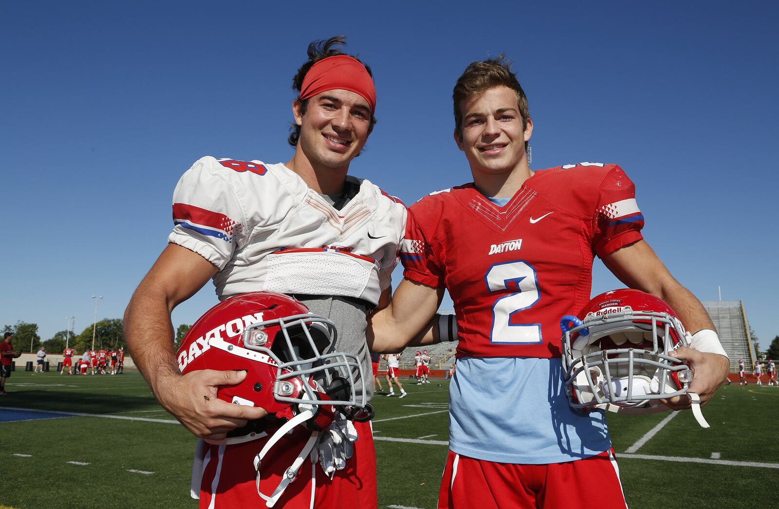 Tucker (left) and Drake Yinger play football for the University of Dayton. Earlier this year, their father, Dan Yinger, died in a fall while cleaning down spouts. Friends and family held a tailgate celebration at Welcome Stadium on Saturday to honor Dan. LISA POWELL / STAFF