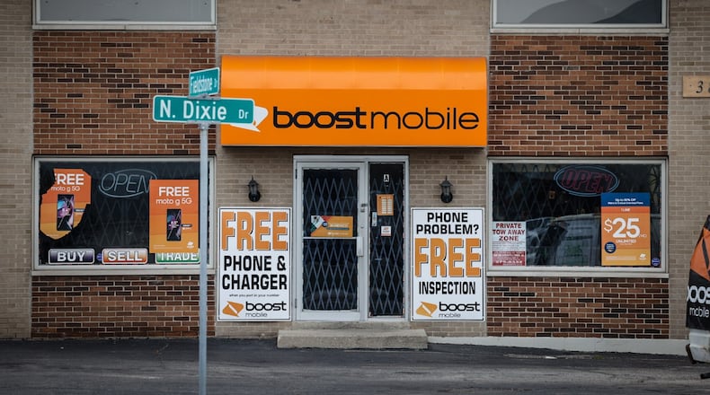 A resident above the Boost Mobile store reportedly shot and killed a man who had broken into the store early Tuesday, Jan. 10, 2023, in Harrison Twp. JIM NOELKER/STAFF