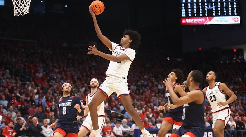 Dayton's Hamad Mousa scores against Duquesne on Saturday, Feb. 15, 2025, at UD Arena. David Jablonski/Staff