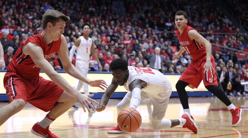 Dayton’s Jalen Crutcher chases a loose ball against Davidson on Tuesday, Jan. 23, 2018, at UD Arena. David Jablonski/Staff