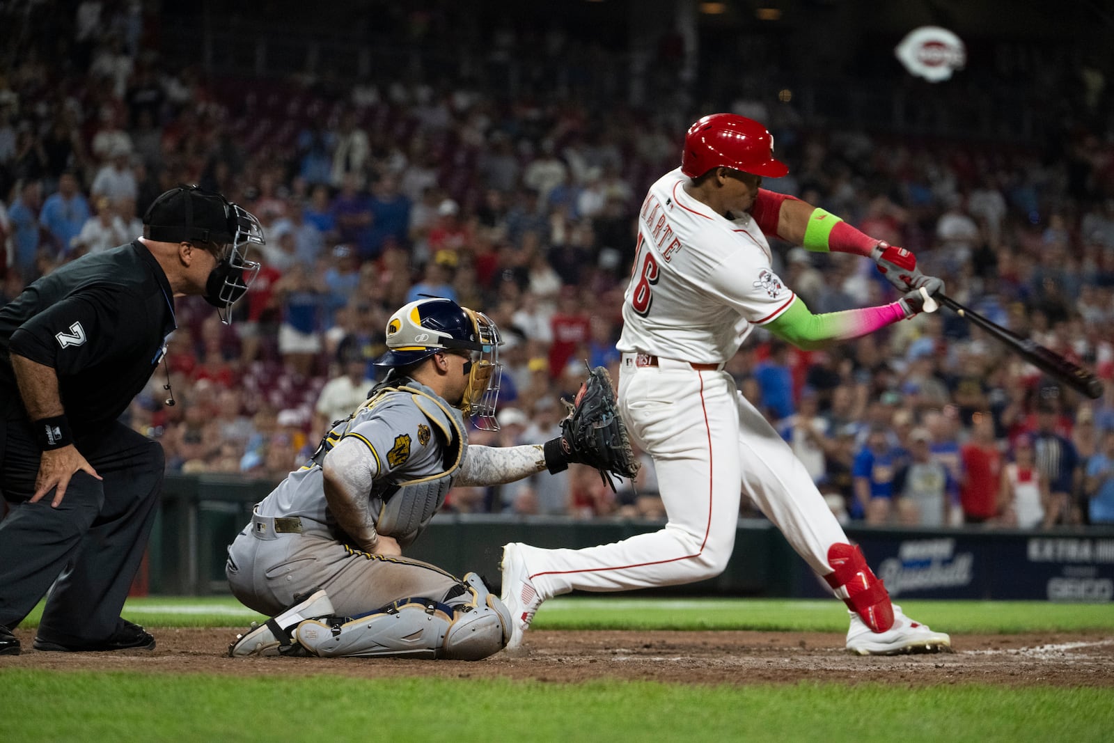 Cincinnati Reds Noelvi Marte (16) hits a home run in the 11th inning of a baseball game against the Milwaukee Brewers, Saturday, Aug. 16, 2025, in Cincinnati. (AP Photo/Michael Swensen)