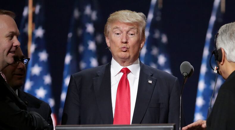CLEVELAND, OH - JULY 21: Republican presidential candidate Donald Trump (C) tests the teleprompters and microphones on stage before the start of the fourth day of the Republican National Convention on July 21, 2016 at the Quicken Loans Arena in Cleveland, Ohio. Ivanka Trump will introduce her father before he gives his acceptance speech tonight, the final night of the convention. (Photo by Chip Somodevilla/Getty Images)