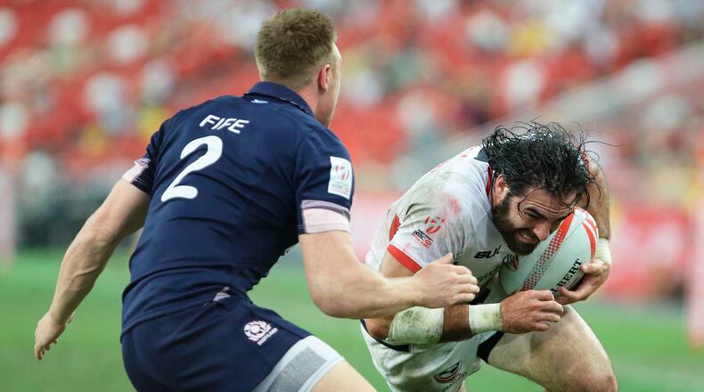 SINGAPORE - APRIL 17: Nate Ebner (R) of United States tries to get past Dougie Fife of Scotland during the 2016 Singapore Sevens Bowl Final between United States and Scotland at National Stadium on April 17, 2016 in Singapore. (Photo by Suhaimi Abdullah/Getty Images)