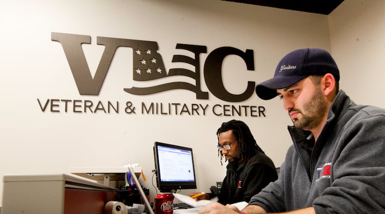 Air Force veteran Jonathan Granata, right, and Army veteran Bakari Lumumba were students working at Wright State University’s Veteran and Military Center in 2014. CHRIS STEWART / STAFF