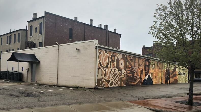 The building at 1100 W. Third St. has been granted a variance for a drive-thru on the backside of the property. The east side of the property has a large, colorful mural. CORNELIUS FROLIK / STAFF