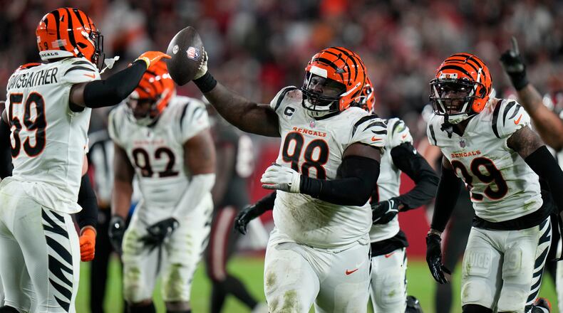Cincinnati Bengals defensive tackle DJ Reader (98) recovers a fumble against the Tampa Bay Buccaneers during the second half of an NFL football game, Sunday, Dec. 18, 2022, in Tampa, Fla. (AP Photo/Chris O'Meara)
