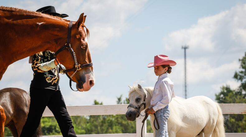 Kara McNutt, from New Lebanon, and her miniature horse, Bob, wait for the judges decision during the Montgomery County Fair 4-H Horse Show Tuesday July 12, 2022. JIM NOELKER/STAFF