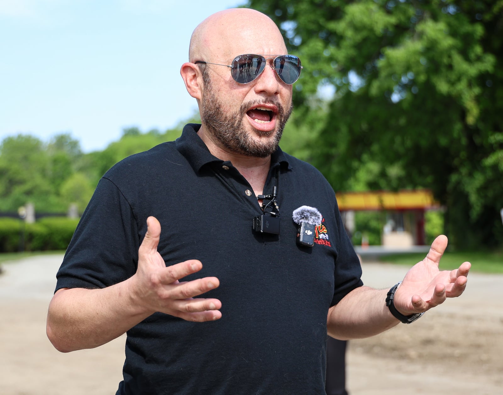 Ryan Levin, who owns Levin Service Company, talks after a ribbon cutting ceremony on Friday at Dixie Twin Drive-In. BRYANT BILLING / STAFF