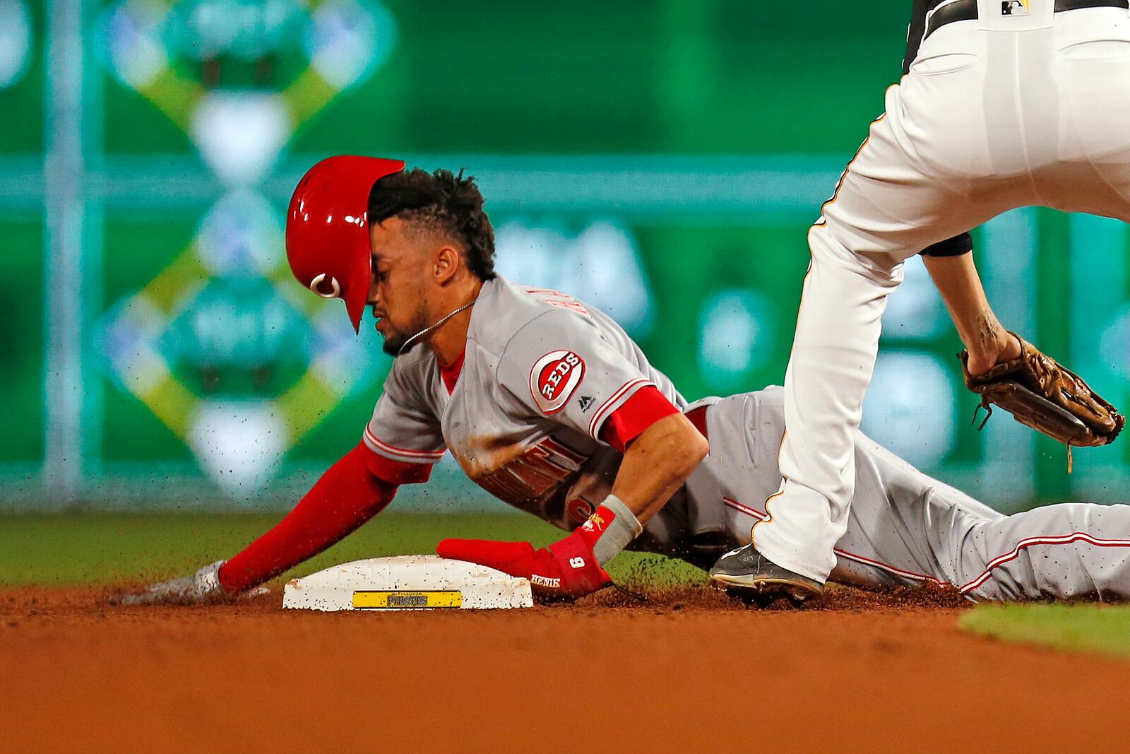 PITTSBURGH, PA - JUNE 15: Billy Hamilton #6 of the Cincinnati Reds steals second base in the ninth inning against Jordy Mercer #10 of the Pittsburgh Pirates at PNC Park on June 15, 2018 in Pittsburgh, Pennsylvania. (Photo by Justin K. Aller/Getty Images)