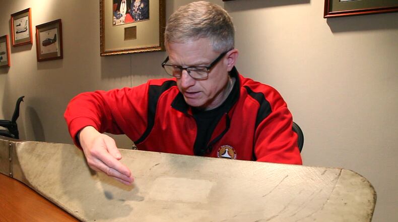Ron Kaplan announced his resignation Tuesday as enshrinement and outreach director of the National Aviation Hall of Fame. In this February 2017 photo, Kaplan points out the signature of Orville Wright on an original Wright propeller. TY GREENLEES / STAFF
