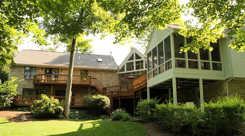 All the home’s main social areas plus the main bedroom have access to the multiple decks that overlook the 3 acres of woods.