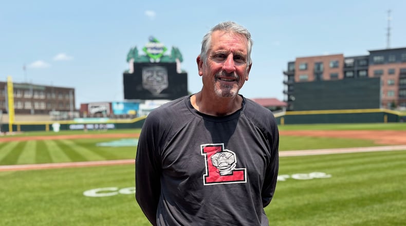 Former big-league pitcher Dave Burba, a graduate of Kenton Ridge High School, poses for a photo before a game at Day Air Ballpark in Dayton on Tuesday, June 3, 2025. Burba is the pitching coach for the Lansing Lugnuts. David Jablonski/Staff