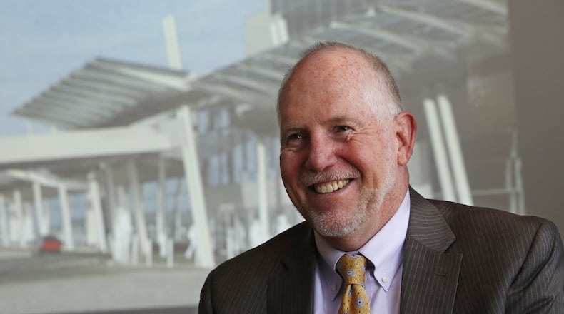 Terrence Slaybaugh, Dayton’s director of aviation, with a graphic of the Dayton International Airport’s new entrance unveiled in January 2016.