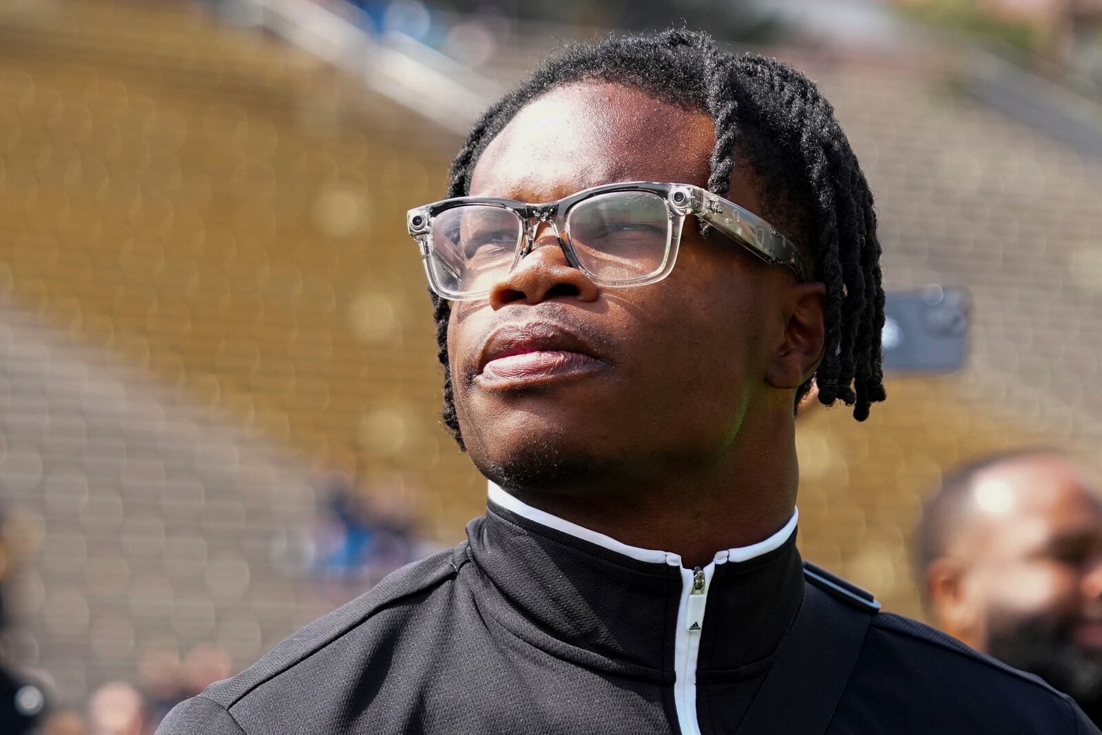 Travis Hunter looks on at his jersey retirement during Colorado's NCAA college football spring game, Saturday, April 19, 2025, in Boulder, Colo. (AP Photo/Jack Dempsey)