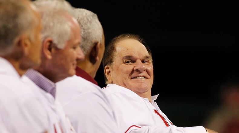 Pete Rose laughs while talking to Dave Concepcion during a ceremony honoring Tony Perez on Friday, Aug. 21, 2015, at Great American Ball Park in Cincinnati. On Monday, Major League Baseball announced it had denied Rose’s reinstatement application. David Jablonski/Staff