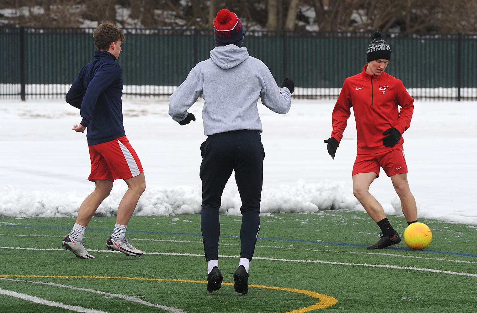PHOTOS: Oakwood soccer players shovel snow to play