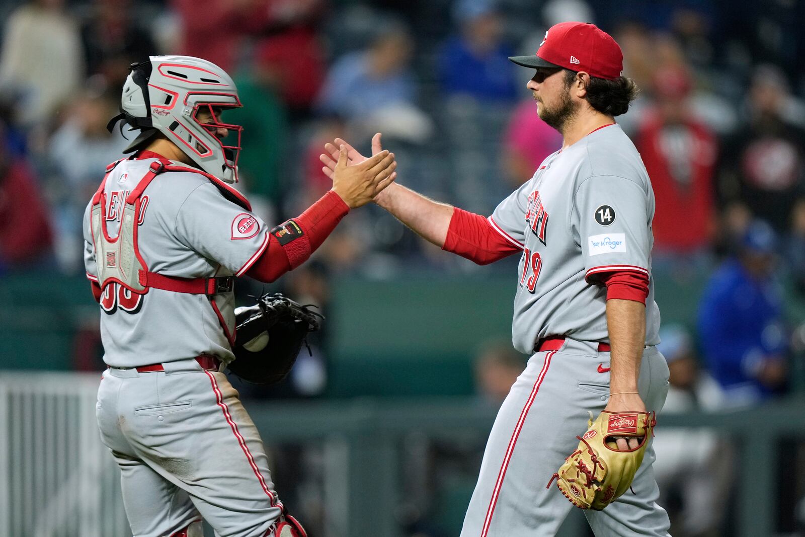 Cincinnati Reds relief pitcher Ian Gibaut, right, and catcher Jose Trevino celebrate after their baseball game against the Kansas City Royals, Tuesday, May 27, 2025, in Kansas City, Mo. (AP Photo/Charlie Riedel)