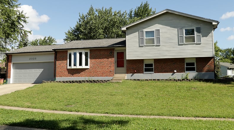 The brick-and-frame tri-level has about 1,830 sq. ft. of living space with 3 bedrooms and a lower-level multipurpose room with additional space for hobby area. The house sits on an elevated, irregular lot with 2-car garage. CONTRIBUTED PHOTO BY KATHY TYLER