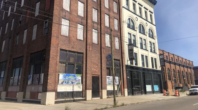 Woodard Development plans to restore the building at 601 E. Third St., red brick at the corner, to create new offices for tech companies. The other two buildings (607 and 617 E. Third St.) have been turned into new offices, called respectively the Avant-Garde, and a new event space and offices, called the Steam Plant. The trio of buildings were vacant for more than two decades. CORNELIUS FROLIK / STAFF