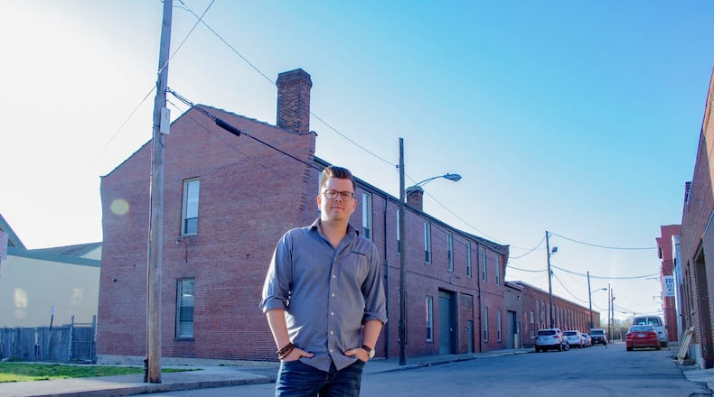 Richard Kaiser, Wilderness Agency founder, stands in front of the company's office at 17 Front St., Dayton. Kaiser said giving employees health insurance would cost as much as adding another employee. CONTRIBUTED