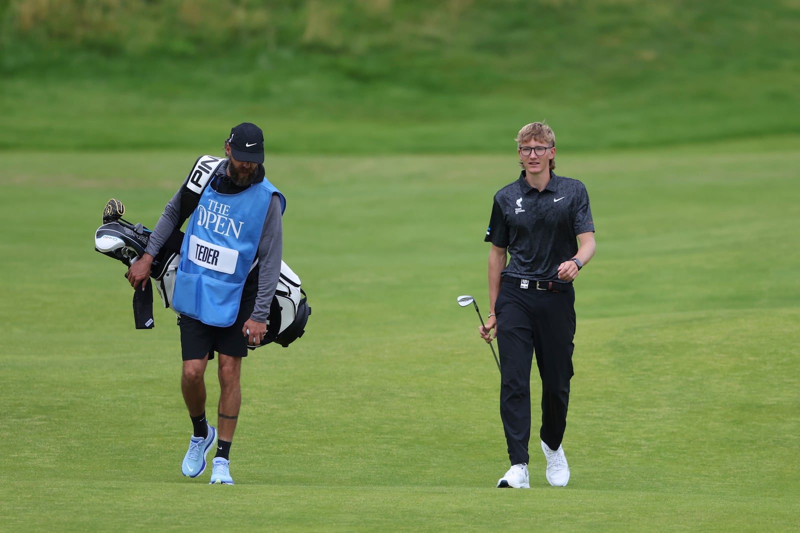 Richard Teder of Estonia walks along the 1st fairway during a practice round for the British Open golf championship at the Royal Portrush Golf Club, Northern Ireland, Tuesday, July 15, 2025. (AP Photo/Peter Morrison)