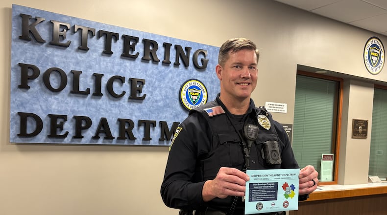 Kettering police officer Edward Drayton, Fairmont High School school resource officer and head of Kettering Safe Senior Program, talks about the new Blue Envelope Program on Wednesday, April 2, 2025, that will aid drivers with autism. JEN BALDUF/STAFF