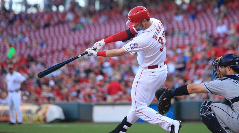 The Reds’ Jesse Winker singles against the Padres on Tuesday, Aug. 8, 2017, at Great American Ball Park in Cincinnati. David Jablonski/Staff