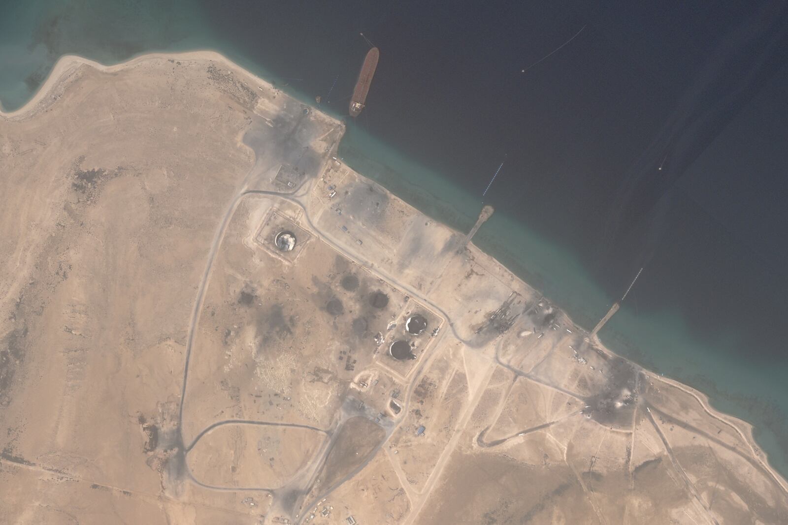 This satellite image from Planet Labs PBC shows the aftermath of U.S. airstrikes targeting the Ras Isa oil port in Yemen on Friday, April 18, 2025. (Planet Labs PBC via AP)
