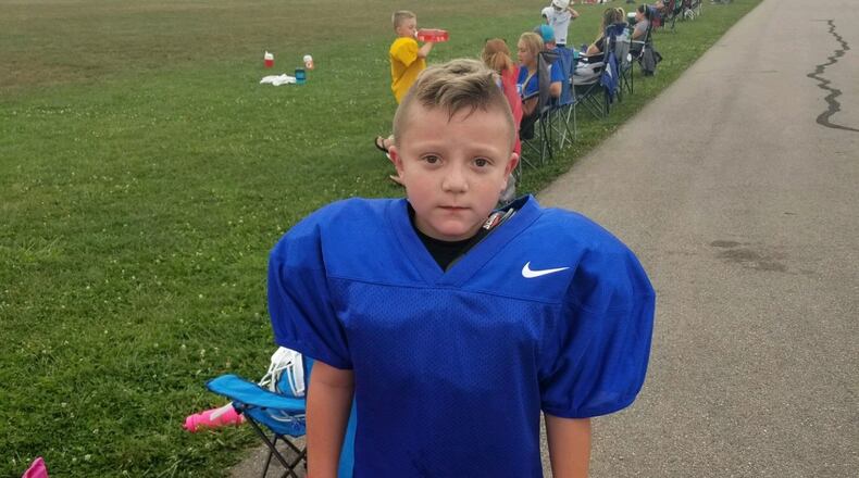 Barrett Fitzsimmons, 8, poses for a photo in his football uniform. Submitted photo