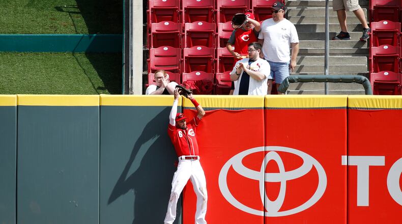 CINCINNATI, OH - JUNE 10: Billy Hamilton #6 of the Cincinnati Reds makes a catch against the center field wall to take a hit away from Matt Carpenter of the St. Louis Cardinals in the ninth inning at Great American Ball Park on June 10, 2018 in Cincinnati, Ohio. The Reds won 6-3. (Photo by Joe Robbins/Getty Images)