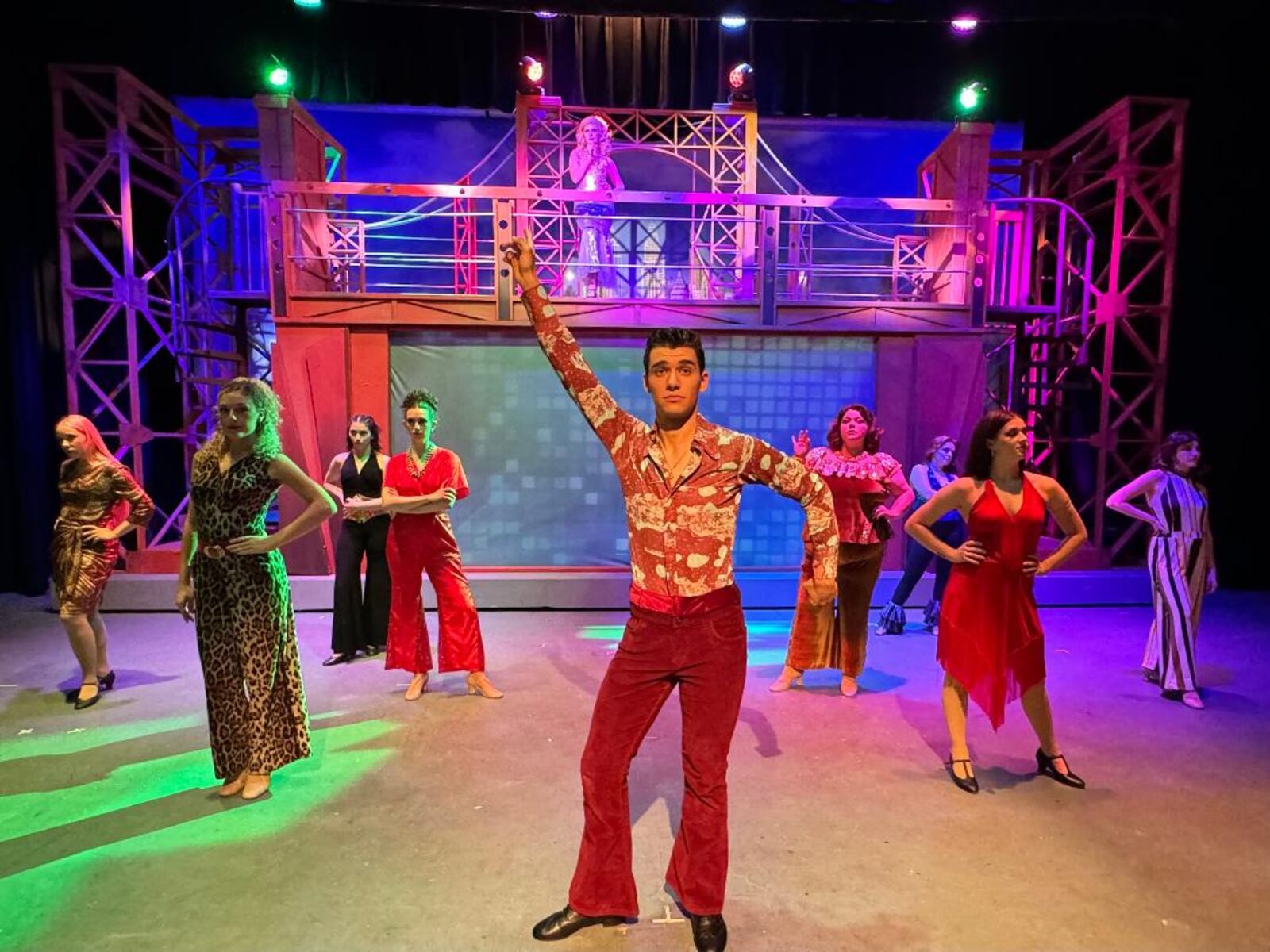 Nick Valle (Tony Manero) and the cast of La Comedia Dinner Theatre's production of "Saturday Night Fever." PHOTO BY JUSTIN WALTON