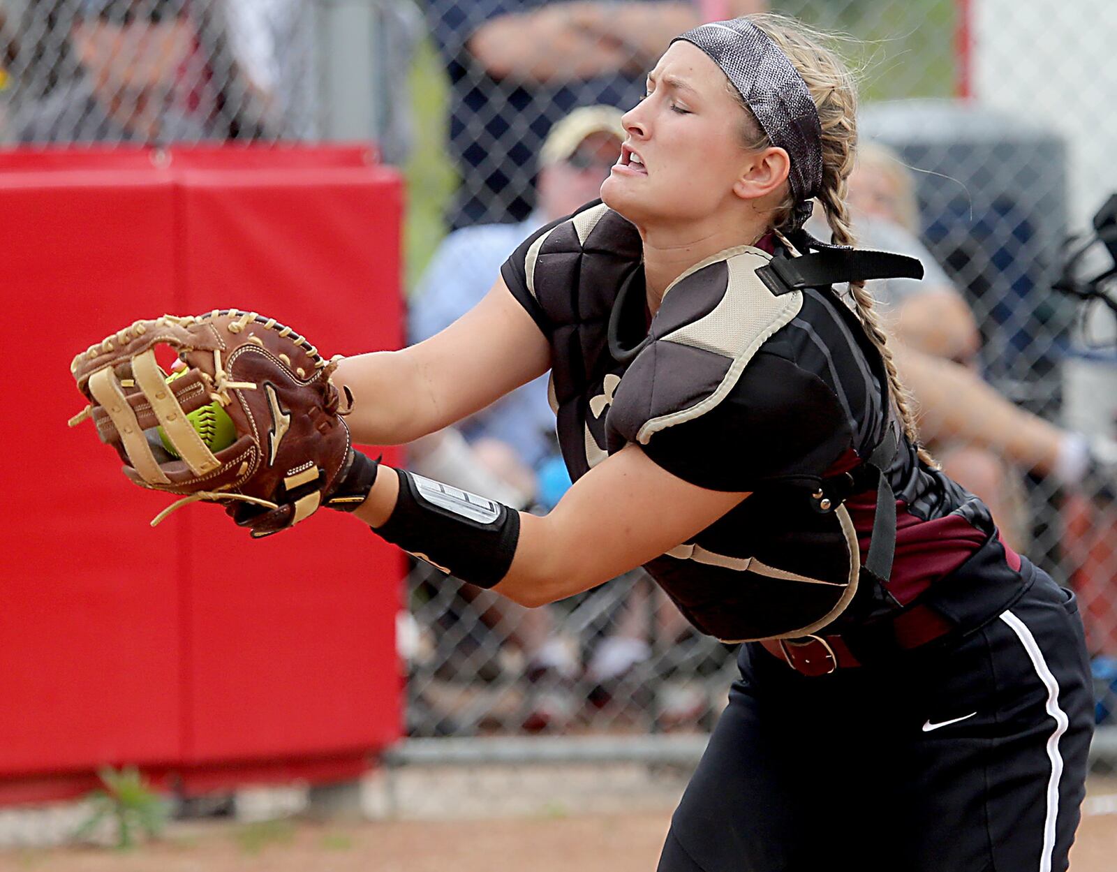 Lebanon catcher Molly Osborne catches a Mason pop-up in foul territory during Sunday’s Division I regional final at Kings. CONTRIBUTED PHOTO BY E.L. HUBBARD