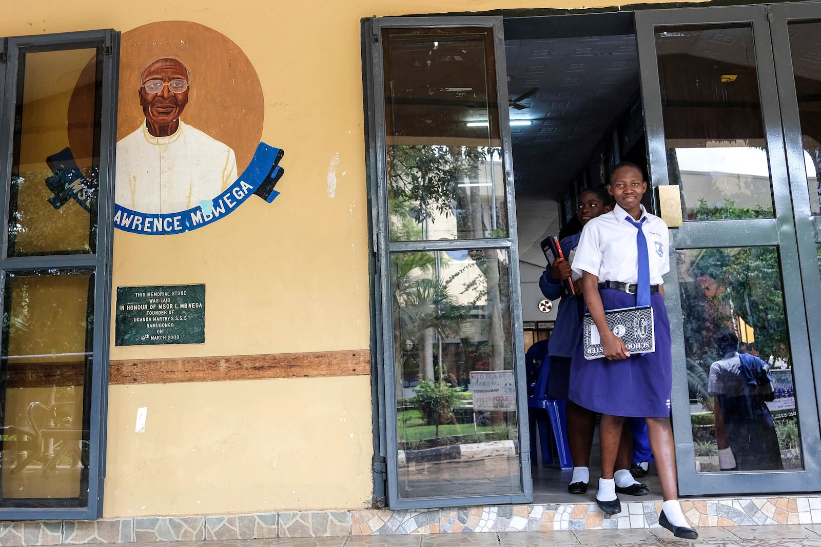 Students walk out of the dining hall at Uganda Martyrs' Secondary School Namugongo, in Kampala, Uganda Monday, May 26, 2025. (AP Photo/Hajarah Nalwadda)
