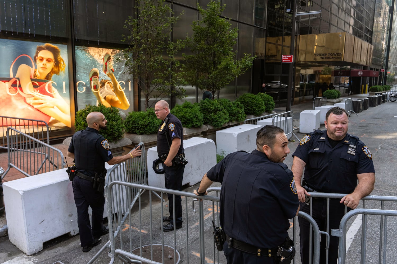 Police officers stand guard outside Trump Tower in midtown Manhattan on Sunday morning, July 14, 2024, one day after former President Donald Trump was shot while speaking at a campaign rally in Butler, Pa. (Adam Gray/The New York Times)