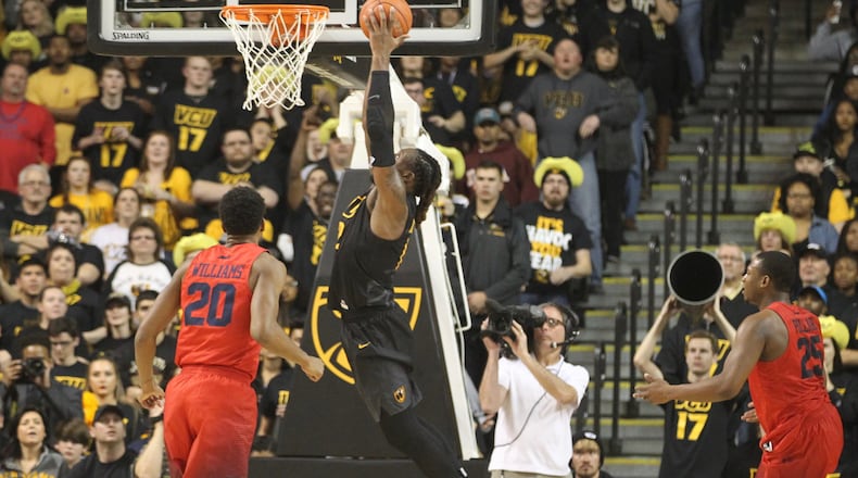 VCU's Mo Alie-Cox dunks against Dayton in January 2017 in Richmond, Va.