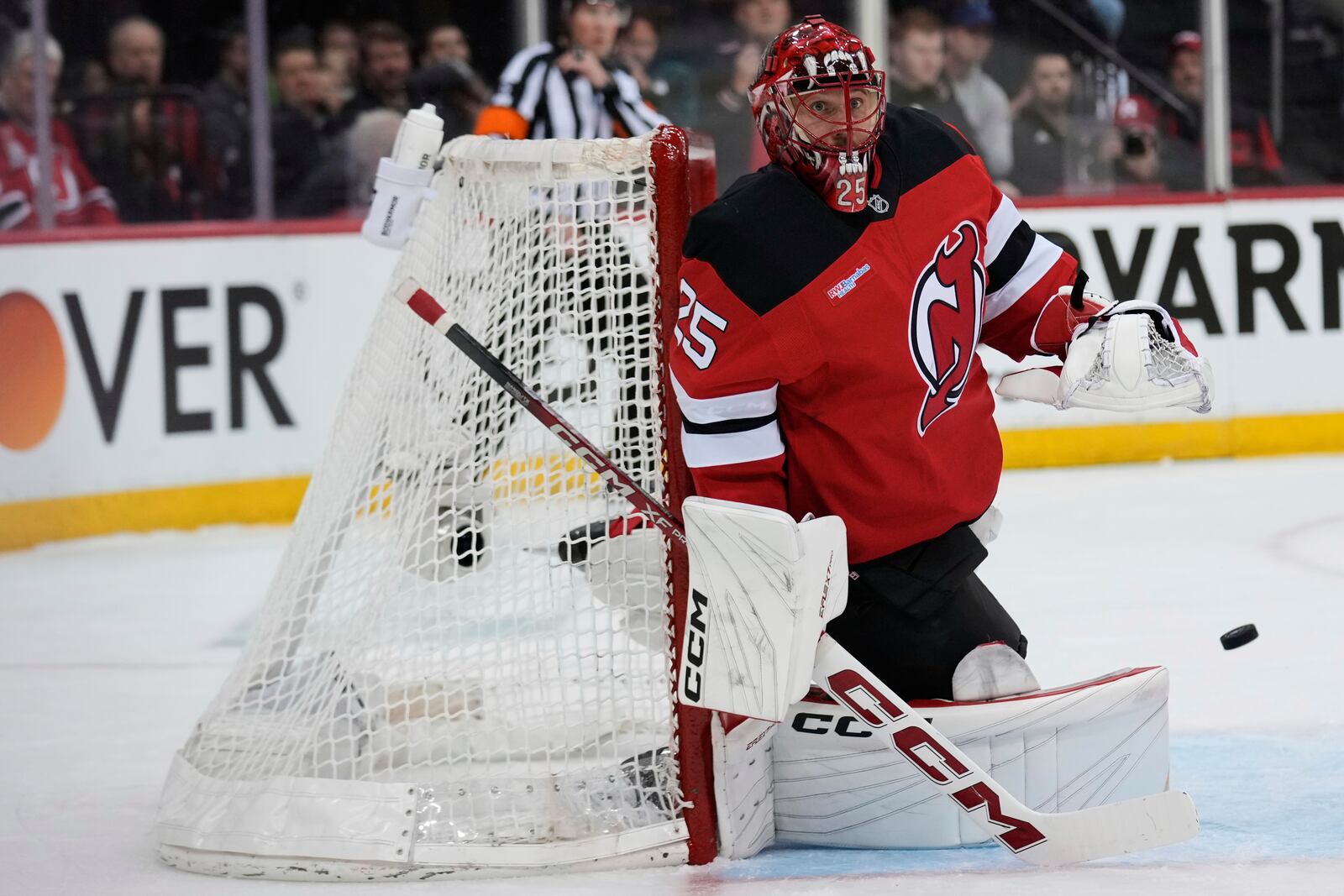 New Jersey Devils goaltender Jacob Markstrom defends the goal during the first period of Game 4 of an NHL hockey first-round series against the Carolina Hurricanes, Sunday, April 27, 2025, in Newark, N.J. (AP Photo/Seth Wenig)