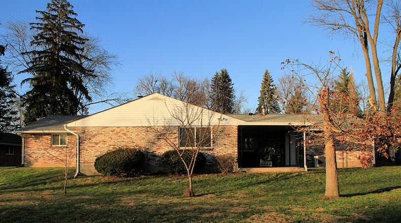 Sliding patio doors open off the recreation room to a covered patio. The recreation room and fourth bedroom were additions to the original floor plan upon construction.