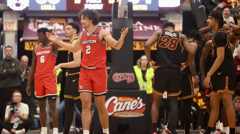 Dayton's Nate Santos protests after being called for a foul in the second half against Loyola Chicago on Friday, Feb. 21, 2025, at Gentile Arena in Chicago. David Jablonski/Staff