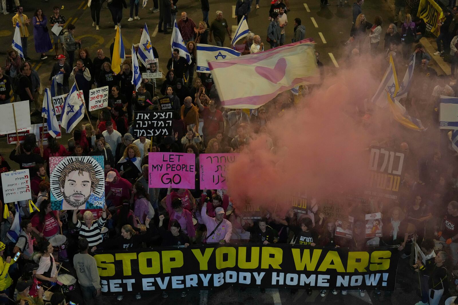 People take part in a protest demanding the immediate release of hostages held by Hamas in the Gaza Strip, in Tel Aviv, Israel, Saturday, April 5,2025. (AP Photo/Ariel Schalit)