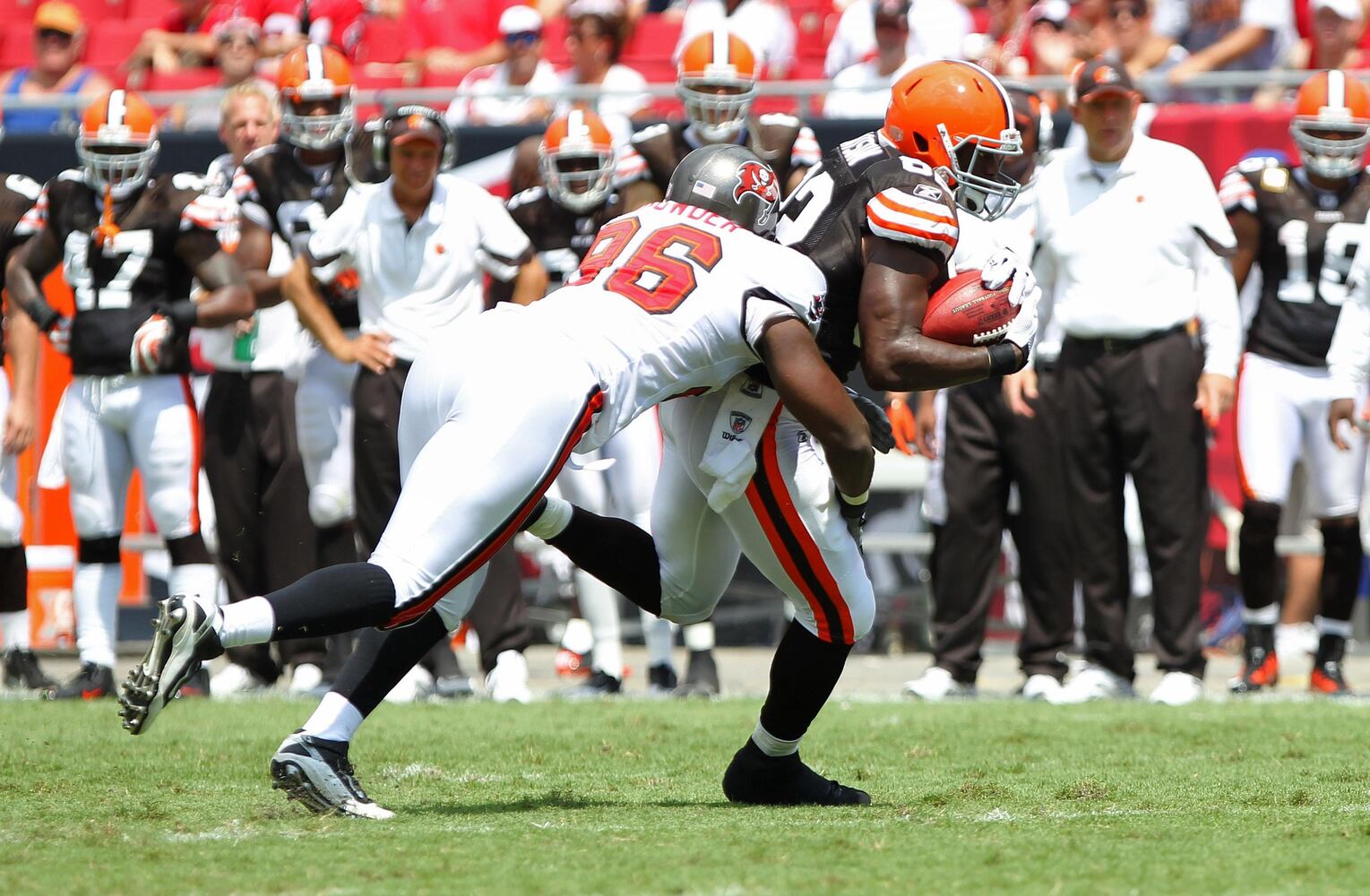 Buccaneers defensive end Tim Crowder (96) tackles Cleveland Browns tight end Benjamin Watson (82) during the first half.