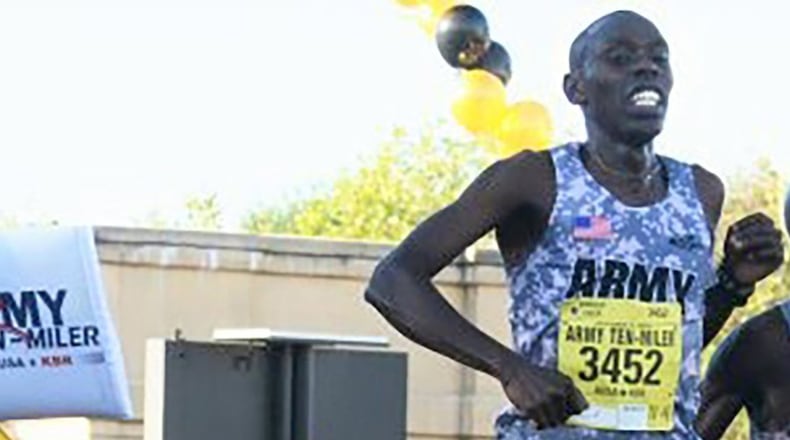 In this file photo, Army Spc. Paul Chelimo (left) wins the Army Ten-Miler, Oct. 11, 2015, with a time of 48:19, less than a step ahead of his teammate Spc. Nicholas Kipruto. Chelimo took first place in an indoor 3,000-meter race in Portland, Jan. 22, 2016, with a finish of 7:44.68, the fastest 3K this year worldwide. (Courtesy photo/David Vergun)