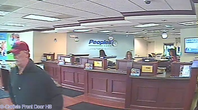 A surveillance camera took a photo of the man believed to have robbed the Peoples Bank branch in Carlisle on March 14, 2019. Carlisle police have identified him as Mark Lunsford, 58, of Hamilton. He is being held on a felony theft/receiving stolen property charge in Dearborn County, Ind. Lunsford is also a person of interest in two 2016 bank robberies in Franklin and Springboro. CONTRIBUTED